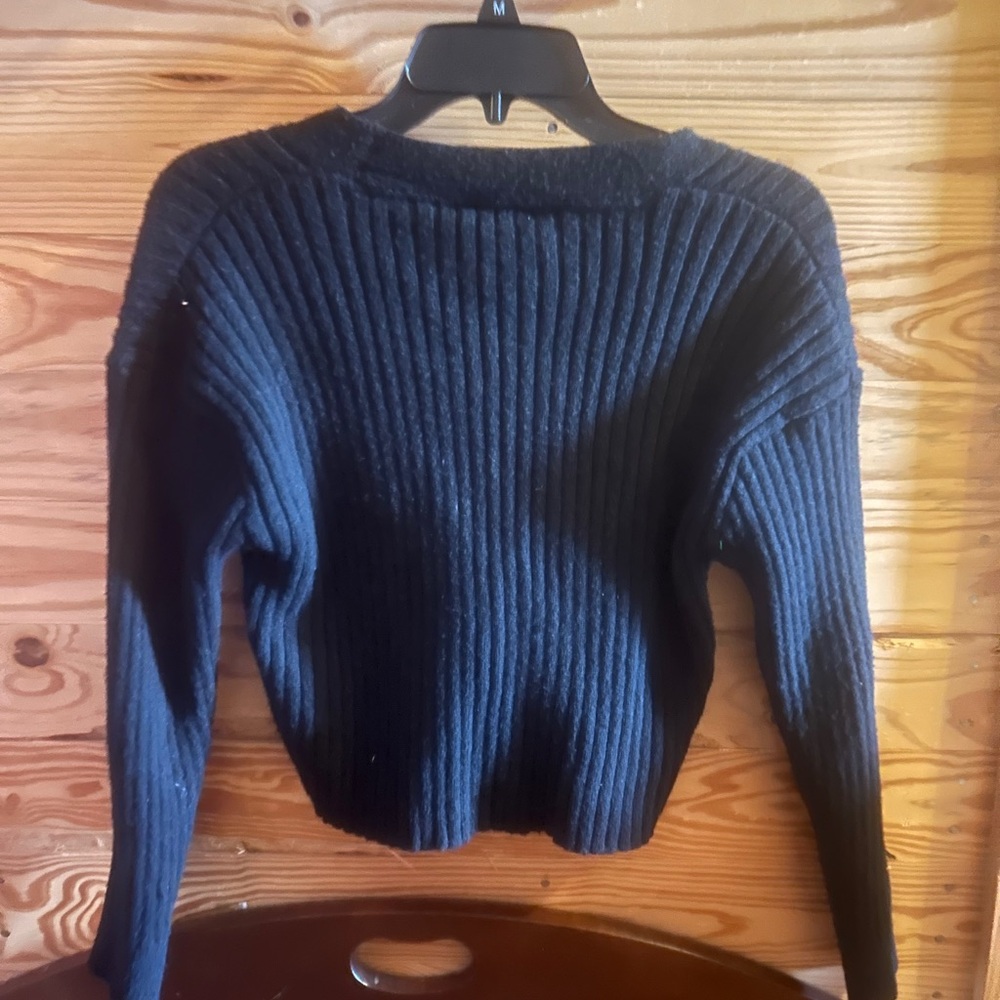 small black sweater
